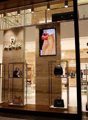 <strong>Aigner</strong><span><b></b></span><i>→</i>